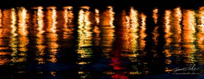 Colourful City lights reflection off the water surface