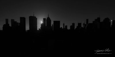 JCCI-100210 - Melbourne city skyline silhouetted by a dramatic sunset in black and white