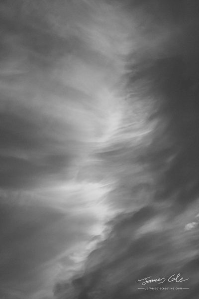JCCI-100234 - Wispy black and white clouds captured by the warm sunset