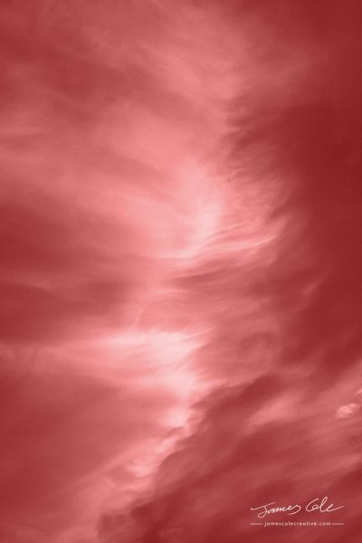 JCCI-100239 - Wispy reddish brown clouds captured by the warm sunset