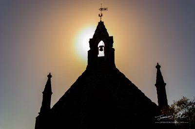 JCCI-100600 - Silhouette of old church in Bulla Victoria with sun setting behind the bell tower