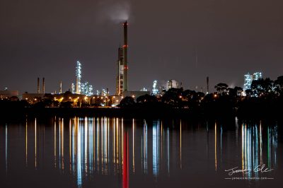 JCCI-100606 - Night-cap lights from factory refinery reflecting in blurry streaks on the Yarra river