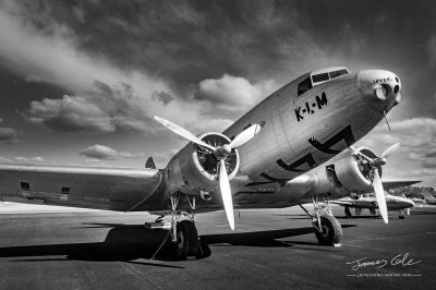 JCCI-100625 - Vintage Douglas DC-2 twin propeller aeroplane parked on runway in black and white
