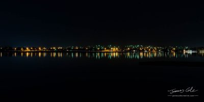 Nighttime street lights reflecting blurry streaks along the waterfront of Lake Wendouree in Ballarat